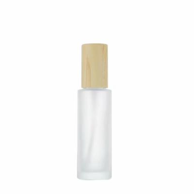 China Non Spill Cosmetic Packaging Set Normal Frosted Glass Bottles For Lotion With Wood Grain Cover for sale