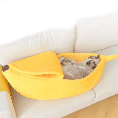 China Viable Semi-Open Soft Cute Warm Cat Dog Bed Plush Sofa Pet House Banana Resistant Sleeping Pet Beds for sale