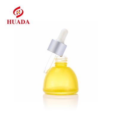 China 2021 New Design Cosmetic Skin Care Products 35ml Glass Bottle Yellow Skin Care Dropper Essential Oil Glass Packaging for sale