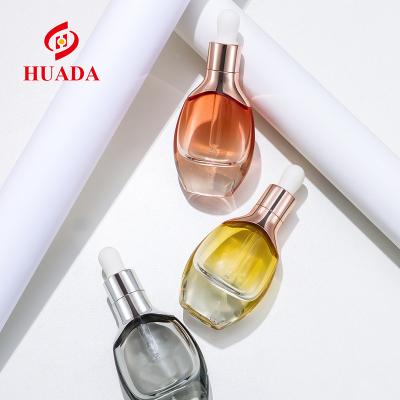 China New Style Oblate 40ml Shoulder Sleeve Glass Dropper Bottle Cosmetic Thick Bottom Essence Bottle Factory Stock Cosmetic Bottle for sale