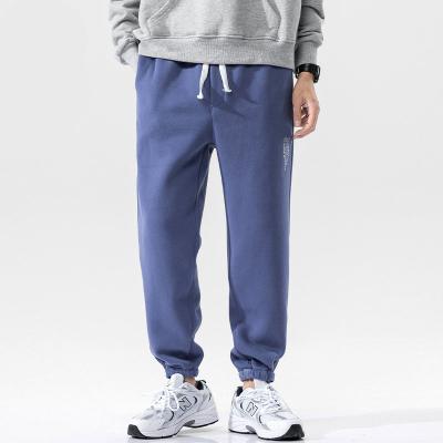 China Custom Anti-wrinkle logo men's elastic bottom sweatpants for sale