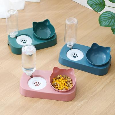 China New Automatic Wholesale Non-slip Oblique Plastic Cat Bowl With Drinking Kettle Cat Type Floating Double Food Bowl Pet Bowl for sale