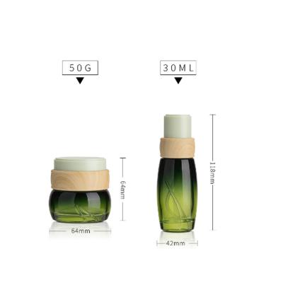 China 30ml Package Lotion Bottling Glass Bottle Container Glass Cosmetic Green Bamboo Bottles for sale