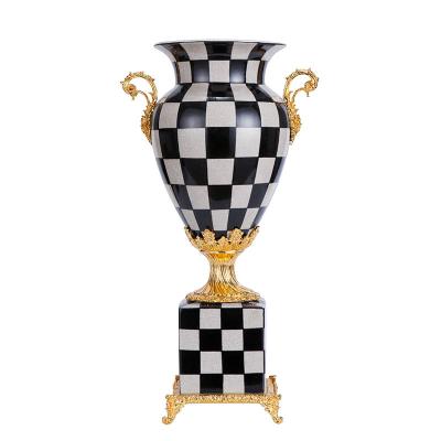 China Art Deco Classic Crafts Statue Plaid Pattern Black And White Home Decor Vase With Gold Handle Decorative Ceramic Vase Desktop Decoration for sale