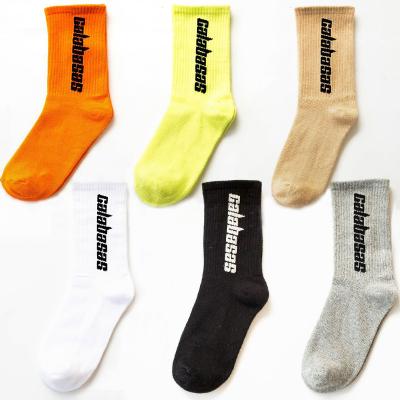 China New Trend Sports Men's Breathable Socks Couple Letter Pure Color Knitted Cotton Crew Socks Wholesale for sale