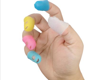 China New Comfortable Soft Silicone Instruments Finger Protector Cribs Gummed Finger Cover For Playing Guitar for sale