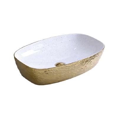 China Modern Large Oval Shape Countertop Gold Color Bathroom Basin Vessel Sink Ceramic Wash Basins for sale