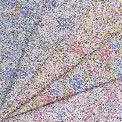 China Small New Design Cotton Fabric Floral Printed Poplin Breathable Soft Cotton Fabrics Shrink-Resistant For Baby Dressing for sale