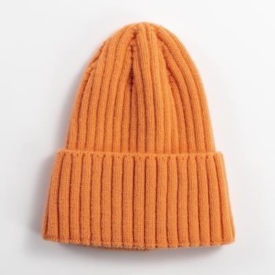 China COMMON Wholesale Stock Custom Knit Beanies with Custom Logo bulk beanie cheap with custom label for sale