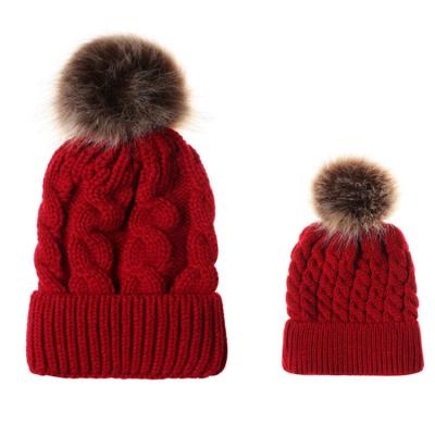 China COMMON 100% Acrylic Wring Jacquard Beanie With Faux Fur Head Cuff Winter Top Hats for sale