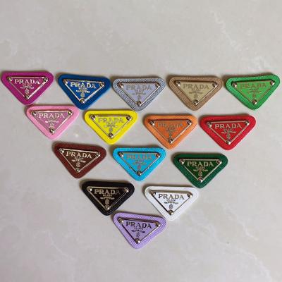 China Popular Best Selling Viable Decorative Brand Logo Triangle Patch Metal Leather Label Clothing Leather Shoes Hat Badge Label for sale