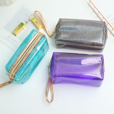 China Custom Fashion Women PVC Clear Cosmetic Bags Plastic Transparent Travel Glitter Makeup Bag for sale