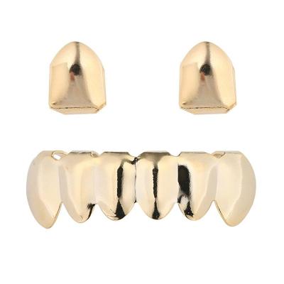 China Hiphop hip hop teeth grillz Halloween dress single tooth and lower teeth combination gold tooth grillz for sale