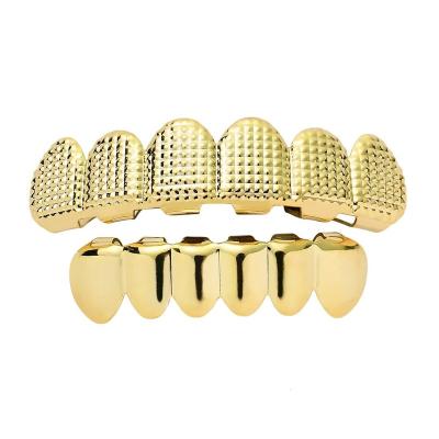 China 2020 Hiphop Gold Big Teeth Grid Texture Uneven Hip Hop Braces Grill for sale