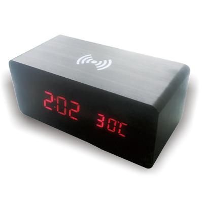 China Antique Style 3 In One Tabletop Wood Led Alarm Clock With Wireless Charging Pad for sale