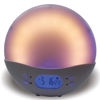 China USB Charger Round Shape Sunrise Radio Alarm Clock With Kick Stand for sale