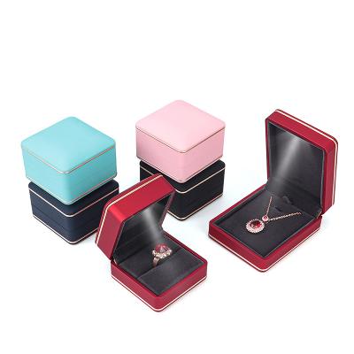 China Newest Color LOGO Plastic Jewelry LED Light Bracelet Pendant Jewelry Boxes Hot Fashionable Custom Ring Box High End Ring With Light for sale