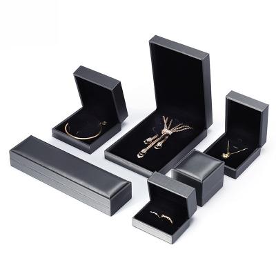 China Fashion Appearance Rectangular Ring Necklace Display Delicate Drawing Handle And PU Leather Jewelry Box for sale