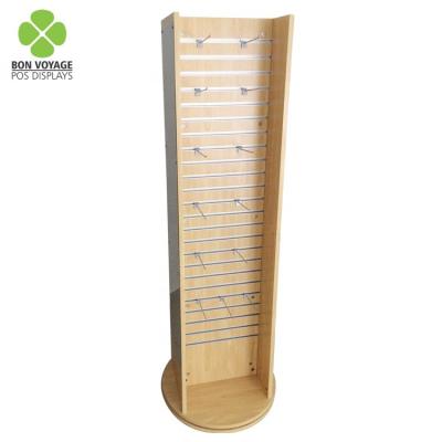 China Custom store retail store floor standing wood rotating slatwall display stand with hanging hooks for sale