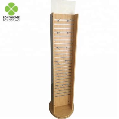 China Environmental friendly wooden slatwall double sided rotating display rack with hooks for sale