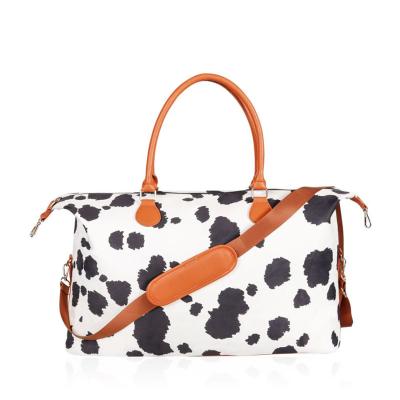 China Fashion Wholesale Large Canvas Weekender Bag Top Handle Cow Print Leather Designer Travel Duffle Bag for sale