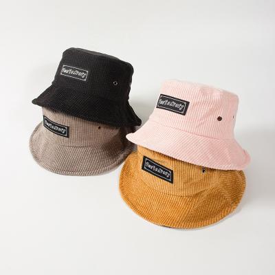 China Bulk Custom Character Logo Woven Label Corduroy Hat Bucket for sale