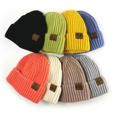 China COMMON Cheap Custom Logo Winter Knitting Hat , Leather Label Fisherman Beanie for sale