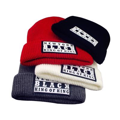 China JOINT Custom Logo Winter Hats Knitted Rubber Hat Patch Beanie Hats for sale