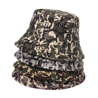 China New Character Ins. Wear Fisherman Hat Camouflage Print Double Side Bucket Hat for sale