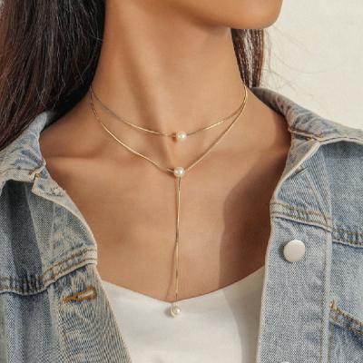 China WeSparking Romantic Elegant Double Snake Bone Chain Necklace With Personalized Pearl Necklace Clavicle Chain for sale