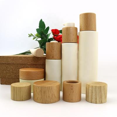 China Non Spill Beech Wood Cover Natural Wooden Lids Plastics Insert For Skin Care Production Personal Care Jars for sale