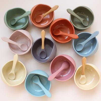 China Silicone Antibacterial Baby Bowl Feeding Spoon Set Bowl Spoon Waterproof Silicone Tableware Children With Wooden Spoon for sale