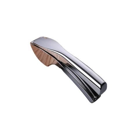 China Zinc Alloy Kitchen Garlic Chopper Manual Handheld Garlic Press for sale