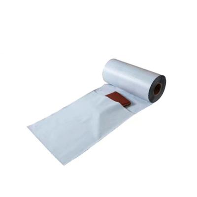 China Strong Adhesive Wholesale Custom Printed White Biodegradable Poly Bags Single Side Continuous Plastic Roll Messenger Bag Roll for sale