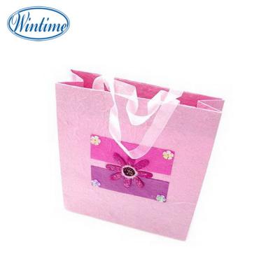 China Recyclable Custom Design Paper Bag Luxury Wedding Ribbon Handle for sale