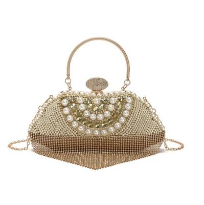 China PU Leather 2021 Clutch Women Luxury Gold Leather Crystal Evening Bags Wedding Shiny Handbags Bridal Metal Shell Grabs Chain Shoulder for sale