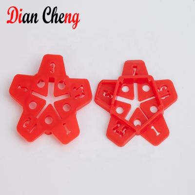 China Modern Multi Size Tile Spacer Multi Functional Star Tile Cuts Five Size Spacers Tile Leveling System for sale