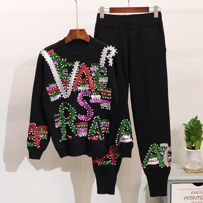 China Anti-pilling Streetwear Women Knit Pant Set High Quality Color Pearl Beads Sweater Pants Tracksuit Winter Two Piece Sweater Set Outfits for sale