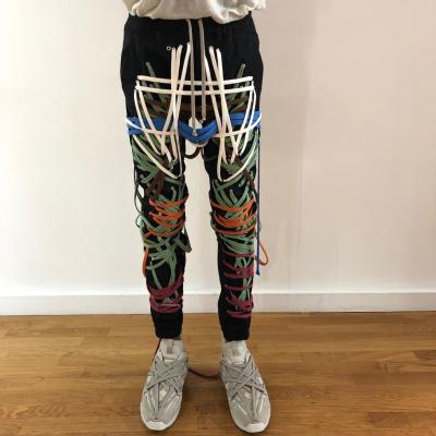 China New Design Personality Anti-wrinkle Pants Streetwear Plus Size Women Pants Handmade Irregular Cross Ties Slim Bandage Cargo Pants for sale