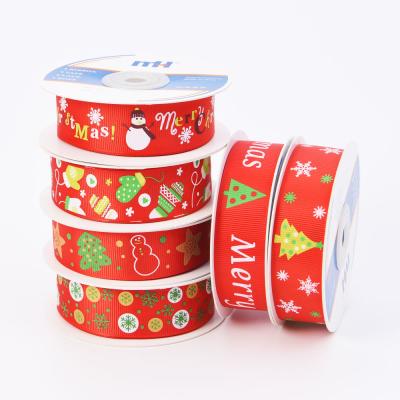 China Merry Christmas Snowflake Print Polyester Grosgrain Ribbon Sustainable Christmas Ribbon 25mm Red for sale