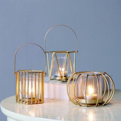 China Tealight Gold Geometric Shape Glass Scented Candle Holder Sets Metal Wire Iron Hollow Tealight Candle Holders For Home Decorations for sale