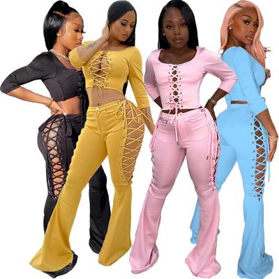 China 2021 QUICK DRY women's fall wear tracksuits 2 piece set lace up two piece set crop top flare pants pants for sale