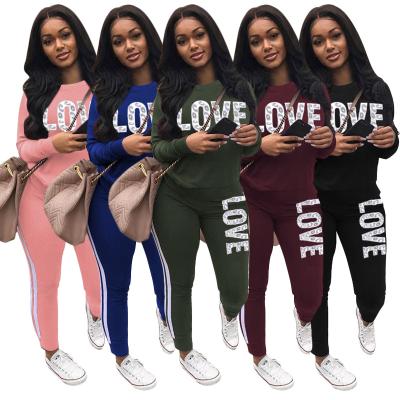 China Women 2021 New Arrivals QUICK DRY Clothing Letter Two Piece Set Print 2 Piece Set Women Pants Two Piece Set for sale