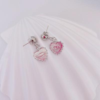 China New style punk ladies eye stainless steel earrings shape embossed ladies to love stainless steel earrings for sale