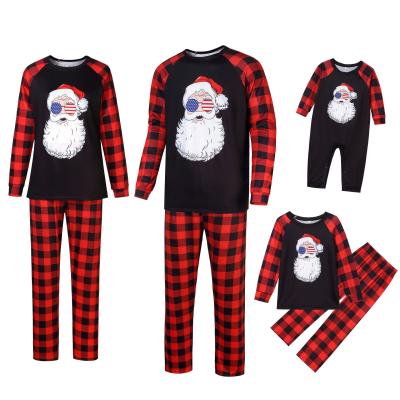 China Hot Sale QUICK DRY Cotton Christmas Pajamas Santa Claus Pattern Red Black Lattice Christmas Family Outfits for sale