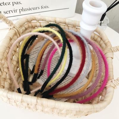 China High quality/factory source artificial circle of solid color winter hair headband winter headband wholesale plastic thin plush plush headbands for sale