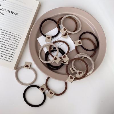 China Korea Factory Sourced High Quality/Factory Sourced Fashion Basic Rubber Bands Ring Circle Milk Coffee Thread Label Heart Shaped Hair Girls for sale