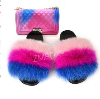 China Fashion Trend 2021 New Women Design Faux Natural Hairy Fluffy Fox Fur Large Soft Fur Slips Matching Purse for sale