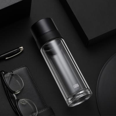 China Healthy Leakproof Sustainable Tea Single Stocked Drinking Frosted Reusable Glass Water Bottle for sale