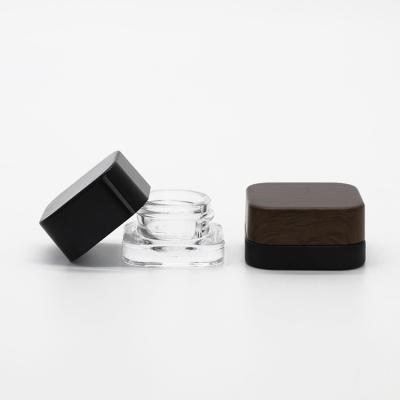 China 5g 9g 5ml 9ml Square Eye Packing Jar Black Air Tight Cosmetic Cream Airtight Glass Cosmetic Jar Tight Jar for sale